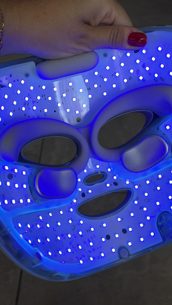 The Shark CryoGlow lit in blue, seen from the front