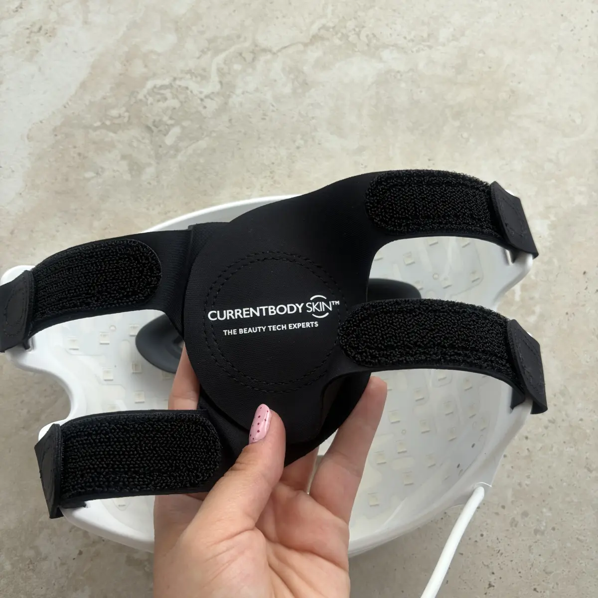 The back of the CurrentBody Series 2 mask showing the multiway rear straps and the chin strap fastened