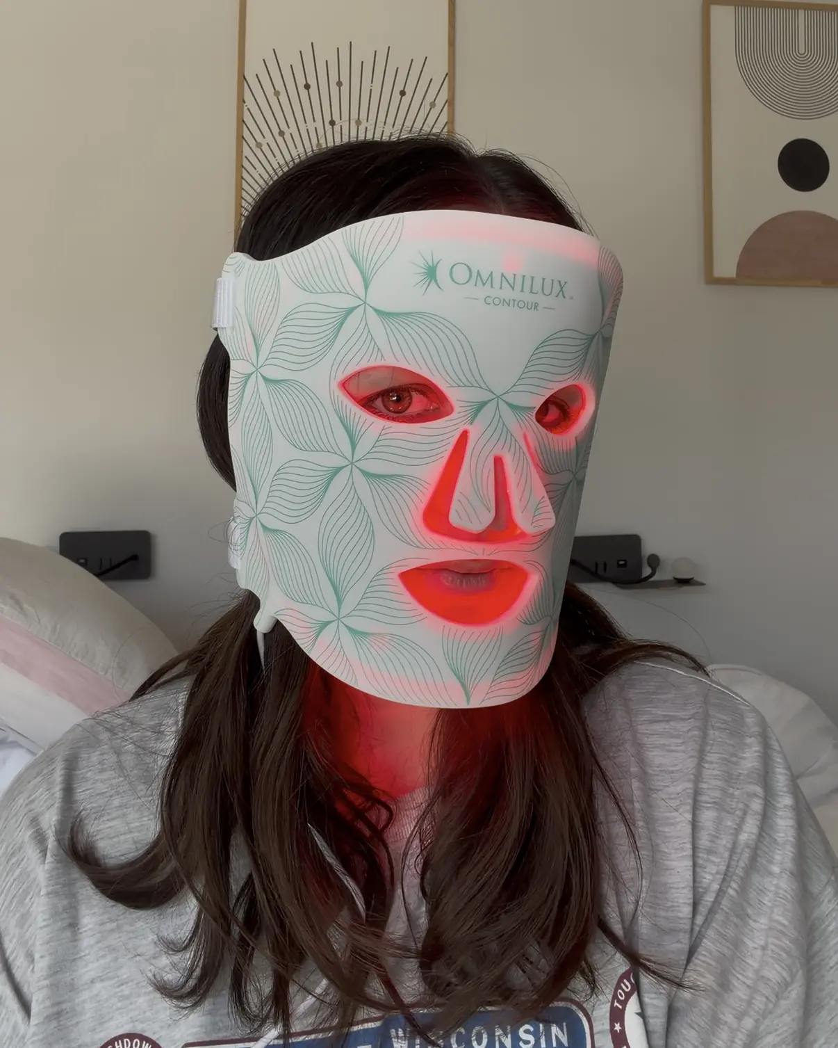 Emilie wearing the Omnilux Contour Face LED mask during a 10 minute session