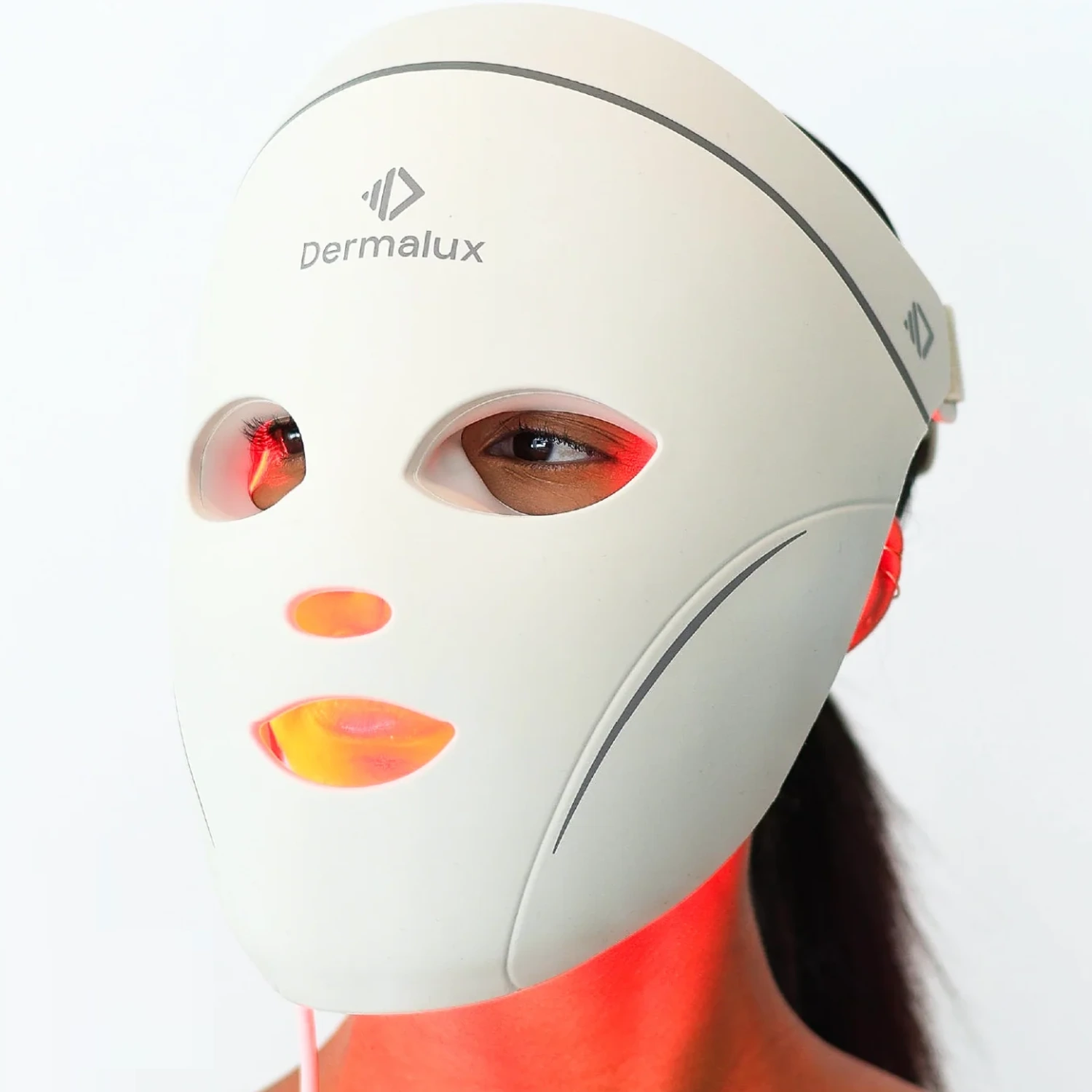 Dermalux LED Face Mask worn, front view, eyes open behind the cutouts