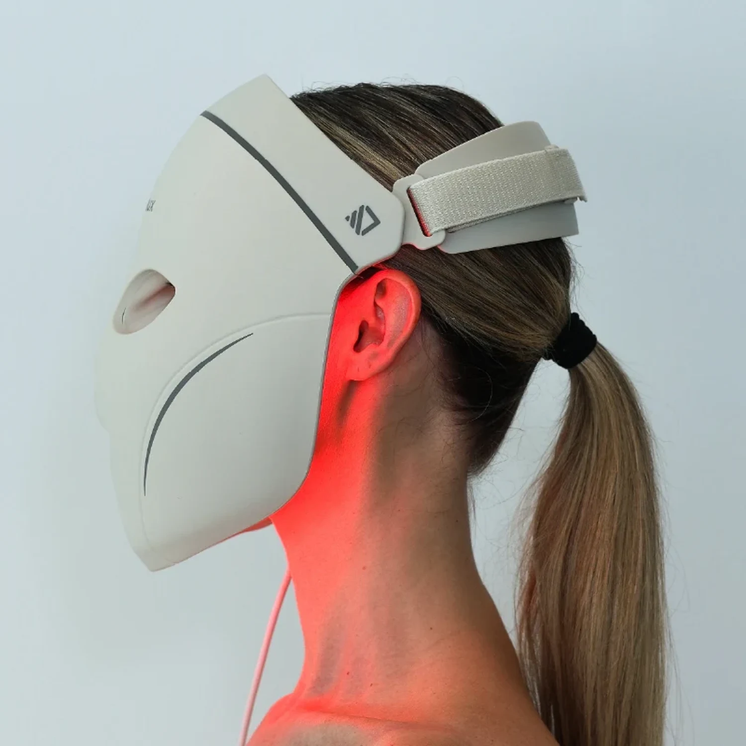 Dermalux LED Face Mask worn, side view, gap between the shell and the jaw