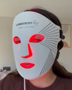 Emilie wears the currentbody series 3 led mask