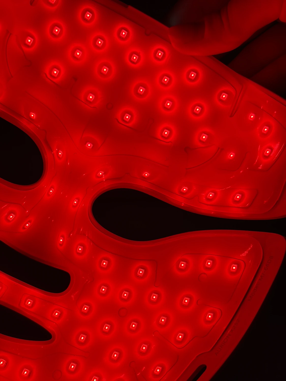 Close-up of the lit silicone inside the Aurion X252 around one eye cutout, showing the last row of emitters